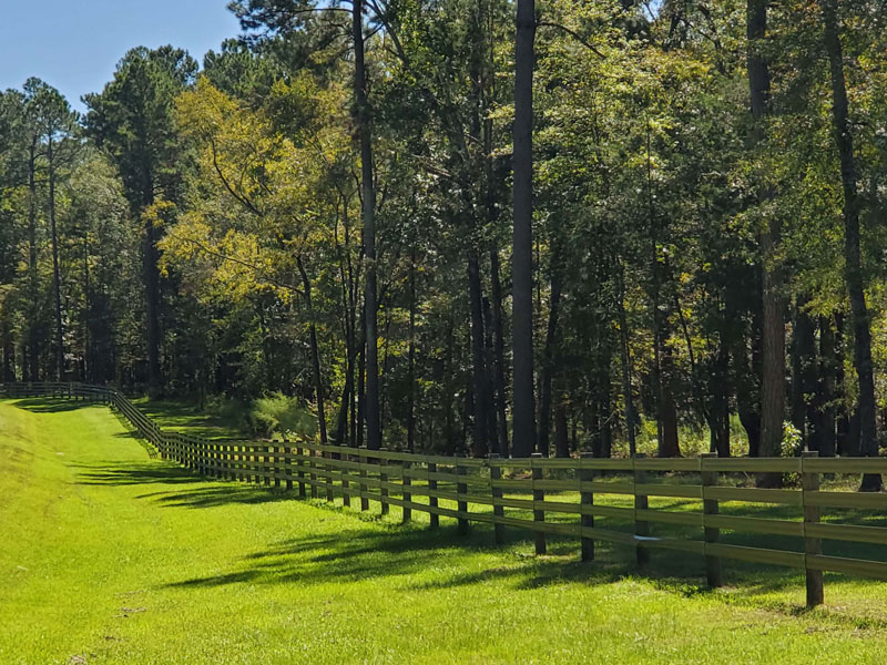 an estate's backyard with custom decorative fence